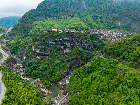 Aerial view showing the scenic buildings and lush green mountains of Wangxian Valley in Jiangxi China