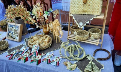 Fototapeta premium Table with assorted handmade crafts and traditional folk art, creative workshop, cultural tradition hobby.