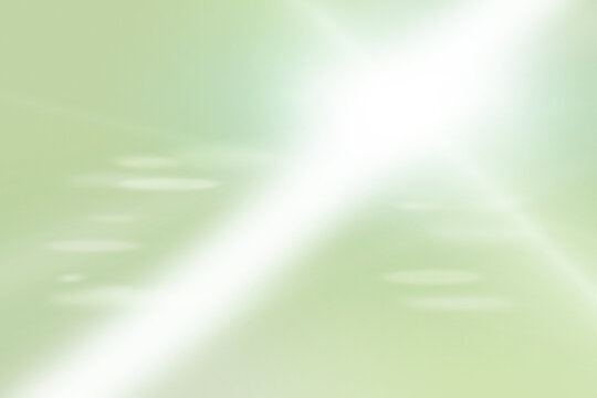 Soft abstract light rays on green gradient background with copy space