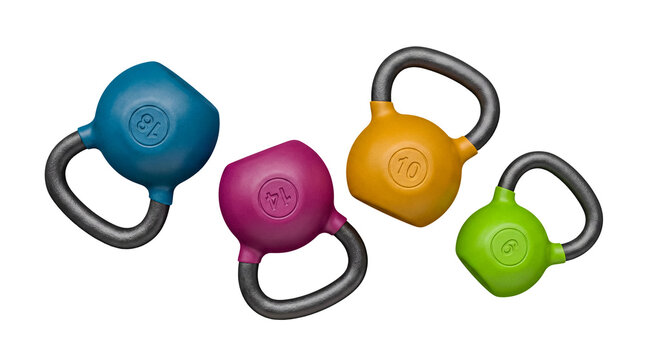 Vibrant set of colorful kettlebells with varying weights, isolated on a transparent background for fitness.