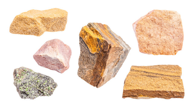 Assorted raw mineral specimens and natural rough-cut rocks, featuring diverse textures, on transparent background.