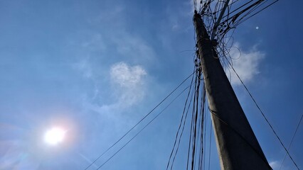 Obraz premium Blue Sky Clouds Power Pole Wire Outdoor Urban Indonesia