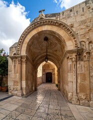 Fototapeta premium Ancient stone archway under blue sky