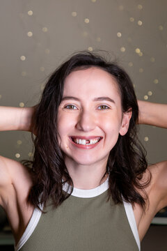 Mature caucasian woman smiles missing a front tooth while expressing emotions during dental procedure