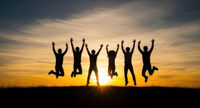 Joyful Silhouettes of Friends Jumping Together Against a Vibrant Sunset Sky