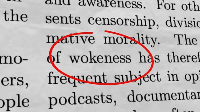 Wokeness Circled in Newspaper Article Culture War and Political Debate Concept