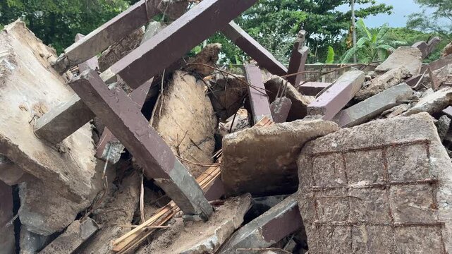 Concrete Block Rubble and Timber Debris at Tropical Building Demolition Site Thailand