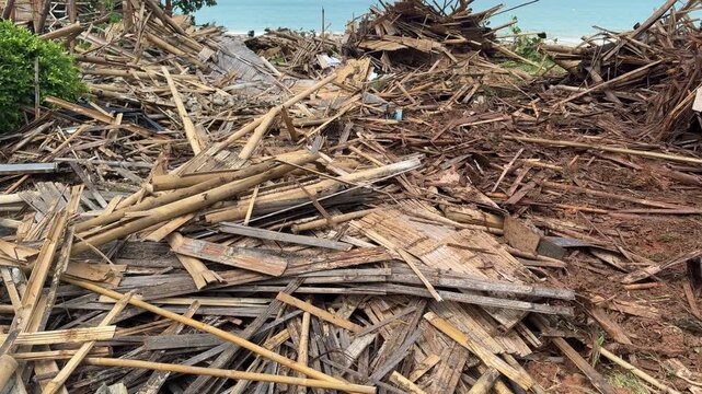 Wide View of Tropical Building Demolition Site with Debris and Beachfront Background Thailand