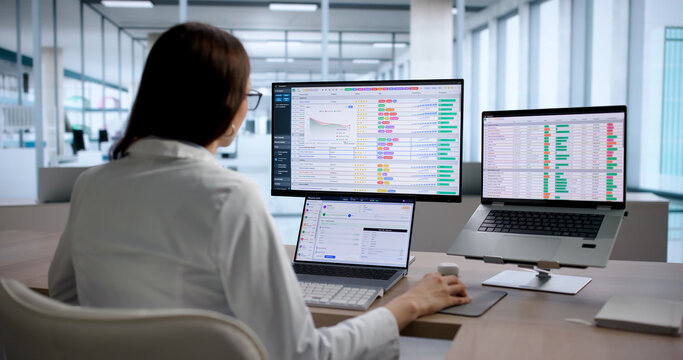 Young Medical Coding Specialist Uses Laptop
