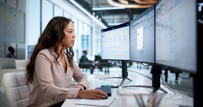 Woman Quality Manager Analyzes Compliance Data On Desktop