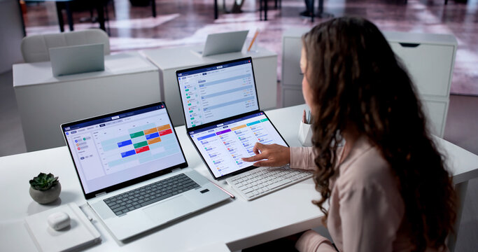Hispanic Woman Reviews Applicant Tracking System Data