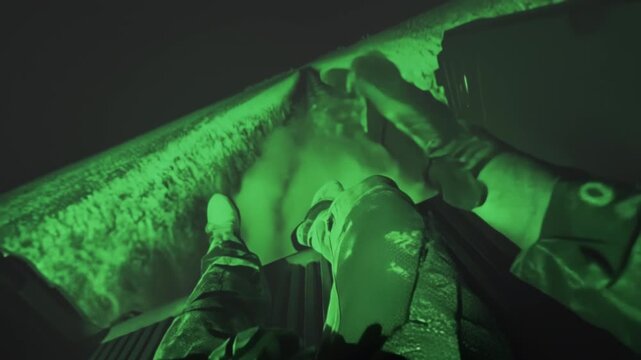 Operator descends silently at night, Tactical night operation with controlled descent and focused execution