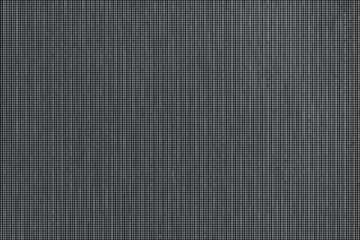 Fototapeta premium A close-up view of a textured dark gray surface with vertical lines