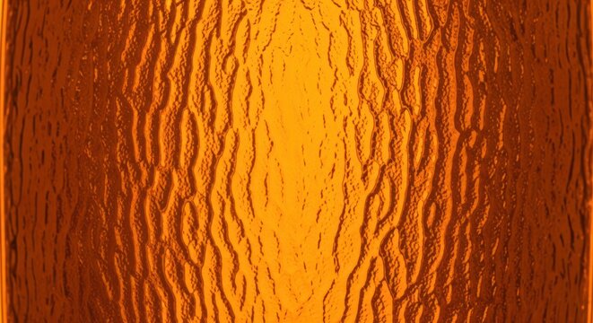 Close up of textured copper metal surface in warm light