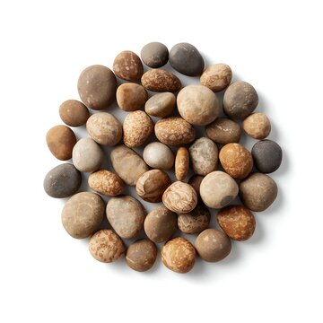 Group of natural smooth brown and grey river stones arranged in a circular pile for spa and massage