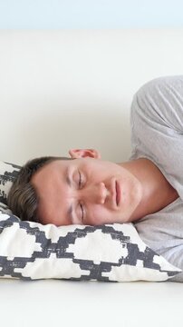 White Man Napping On Couch Pillow, Soft Daylight, Patterned Cushion, Gray Tshirt, Slow Breathing, Subtle Head Turn, Midday Pause After Long Workday, Tired Expression Melting Into Rest