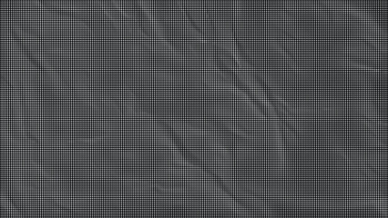 Fototapeta premium A close-up view of a crumpled dark gray fabric with many wrinkles