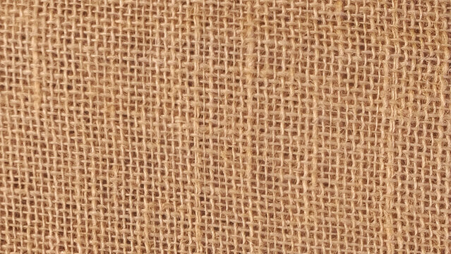 Vintage hessian fiber cloth background macro shot. Texture of burlap