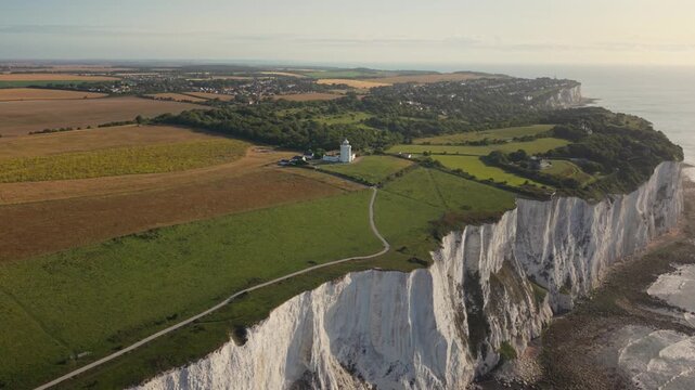 Aerial view of South Foreland Lighthouse on the White Cliffs of Dover overlooking the English Channel and green fields Saint Margaret's at Cliffe, England, United Kingdom.