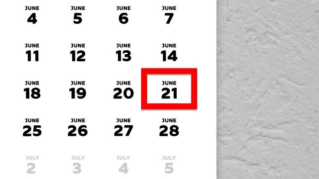 The date June 21st marked with a red cursor on the wall calendar 2026