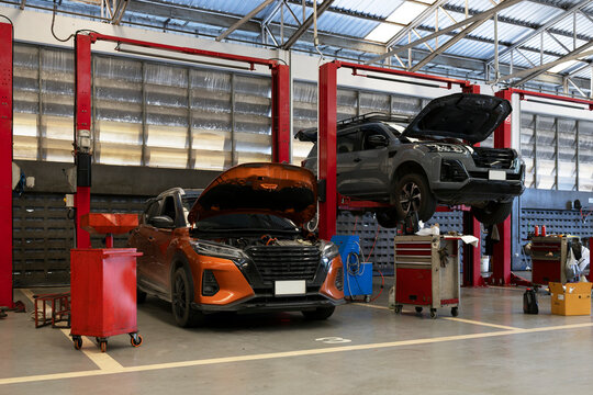 Damaged Car Under Repair in Professional Auto Service Garage