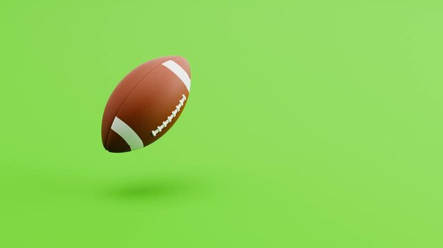 American Football Ball Spinning and Floating on Green Background with Copy Space, Seamless Loop 3D Animation