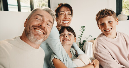 Obraz premium Selfie, portrait and family in home on sofa for memory, bonding or social media post together. Smile, photography and parents with children for profile picture in living room of house for weekend