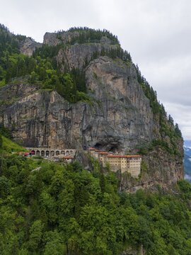 A monastery perched monumentally on a steep rock face, surrounded by dense forests, aerial view, Sumela Monastery, S&uuml;mela Manastırı, Ma&ccedil;ka, Macka, Trabzon Province, Turkey