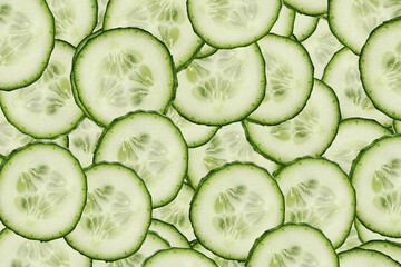 Fresh cucumber slices background. Green vegetable pattern close up. Healthy food texture with organic cucumber pieces. Natural vegan backdrop. Refreshing salad ingredient full frame composition © Paweł Michałowski