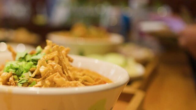 Northern Thai Khao Soi Curry Noodle Soup in a Ceramic Bowl