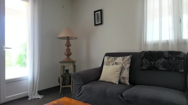 Modern Living Room Interior with Gray Sofa and French Doors