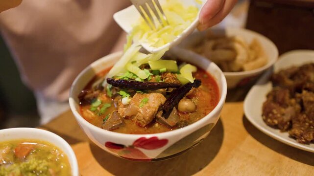 Adding Pickled Mustard Greens to Northern Thai Nam Ngiao Noodle Soup