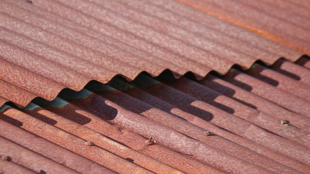 the rusty zinc roof of the house