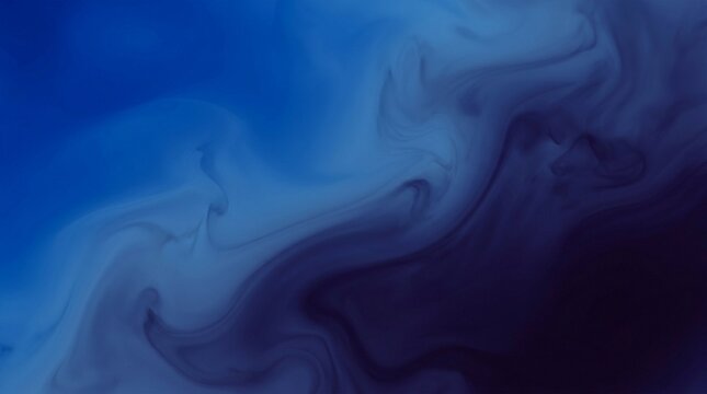 Abstract blue ink fluid swirls and eddies in water for a dynamic background effect