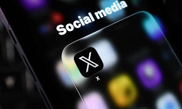 Closeup of the x social media app icon on a smartphone screen, representing the rebranded platform formerly known as twitter