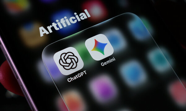 Closeup of a smartphone screen showing the chatgpt and google gemini artificial intelligence mobile application icons in a folder