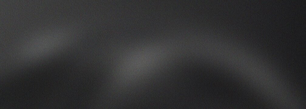 Minimalist black and grey grainy background with soft white light spots and textured noise effect for industrial aesthetic and professional creative website hero sections.