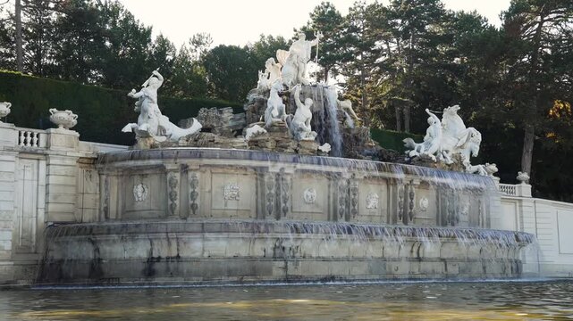 Stone Fountain With Flowing Water and Sculptures Static Shot