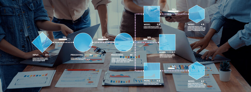 Collaborative Business Team Creating Infographic with Laptops and Charts in Modern Workspace Setting Quark.