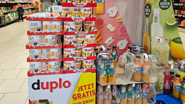 Supermarket aisle featuring snack and beverage displays