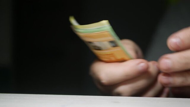 Blurred Shooting with Hands Counting Banknotes, Calculating Salary Payment or Paying in Cash Bills. Financial Investments Concept.
