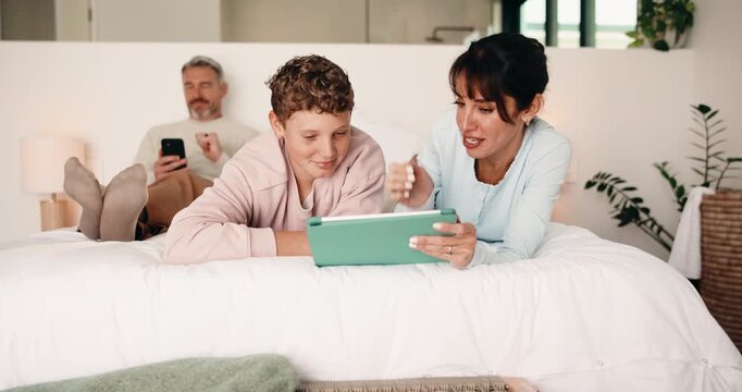 Tablet, high five and mother bonding with kid on bed for quiz game, correct answer and success. Tech, mom and boy with celebration in house for playing online puzzle, problem solving and family fun