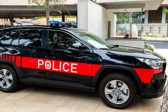 Monaco police patrol SUV parked outside a contemporary security entrance in Monaco