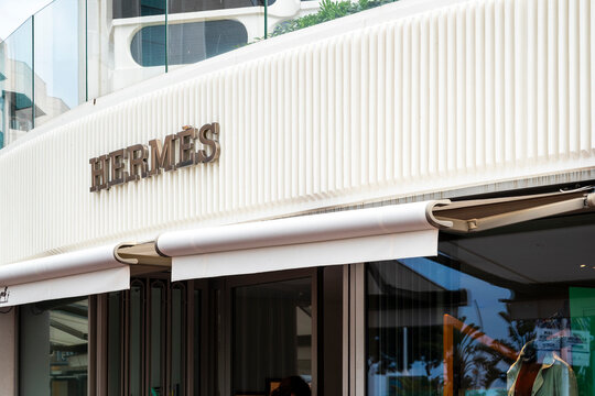 elegant display window of Hermes luxury designer brand boutique in Cannes, France