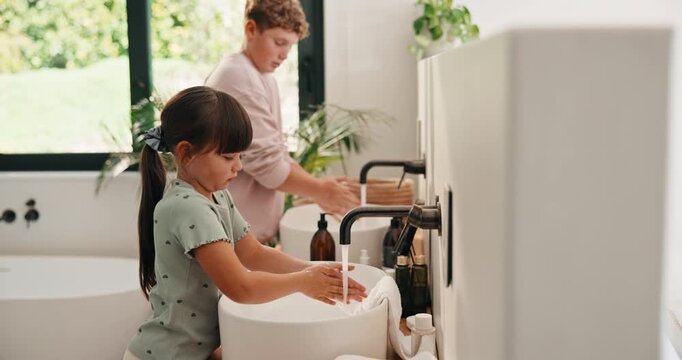 Bathroom, siblings and children by sink for washing hands, cleaning and hygiene in morning. Family, home and girl with boy with water, soap and faucet for wellness, healthy habit and germ protection