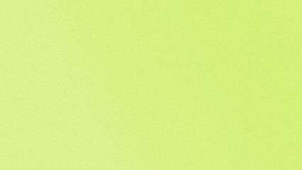 Fototapeta premium Vibrant lime green grainy texture background with fine noise overlay