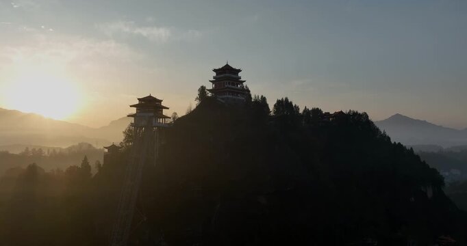 Sunrise and ancient chinese buddha temple landscape in Hunan province,China