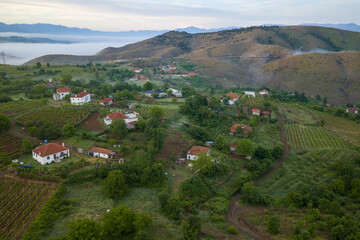 Fototapeta premium Rural houses and agricultural plots in Bukmira village of northern Albania. 