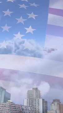 Vertical video: Wind starting US flag overlay rippling, sliding, clouds drifting, revealing skyline
