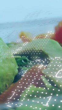 Vertical video: Camera panning showing avocado while binary grid sweeping across measuring ripeness